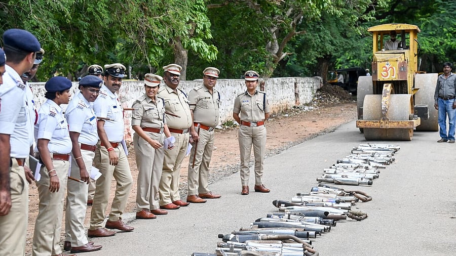 <div class="paragraphs"><p>Mysuru City Traffic Police, led by Commissioner Seema Latkar and DCP (Crime and Traffic) S Jahnavi, DCP M Muththuraj, ACP Traffic H Parashuramappa during a drive launched to destroy defective silencers of seized two wheelers, near Siddartha Nagar Traffic Police Station in Mysuru, on Wednesday.</p></div>